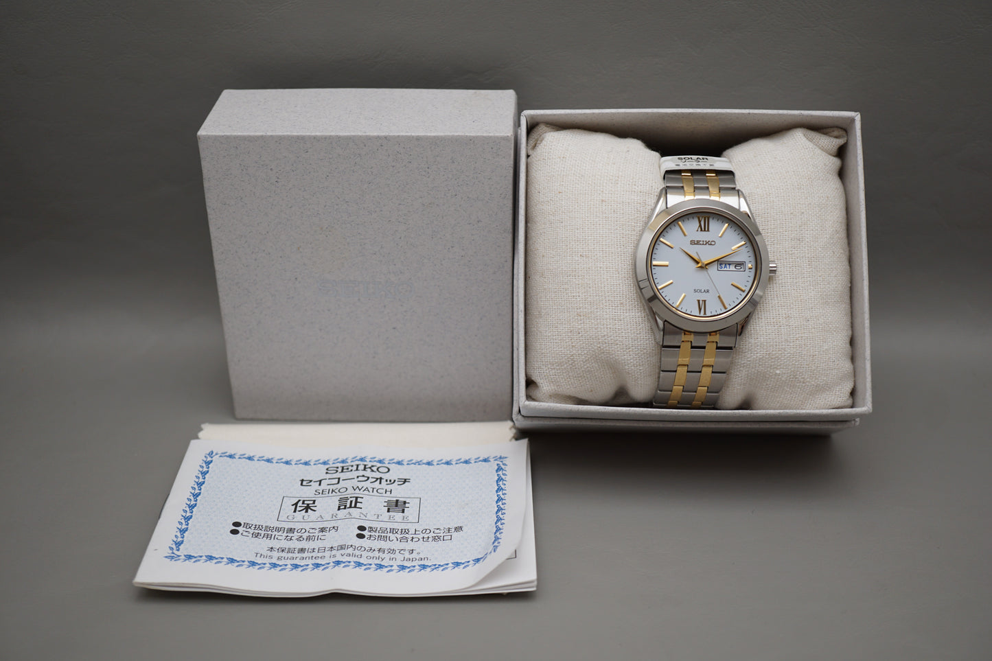 Unworn Seiko Selection SBPX085 V158 Gold Two Tone White Dial Solar Quartz Watch