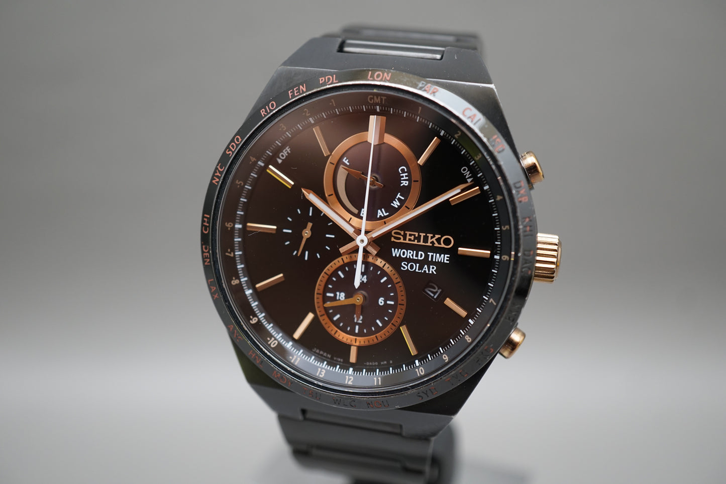 Seiko Spirit SBPJ039 V195 Black Rose Gold Tone World Time Solar Quartz Watch