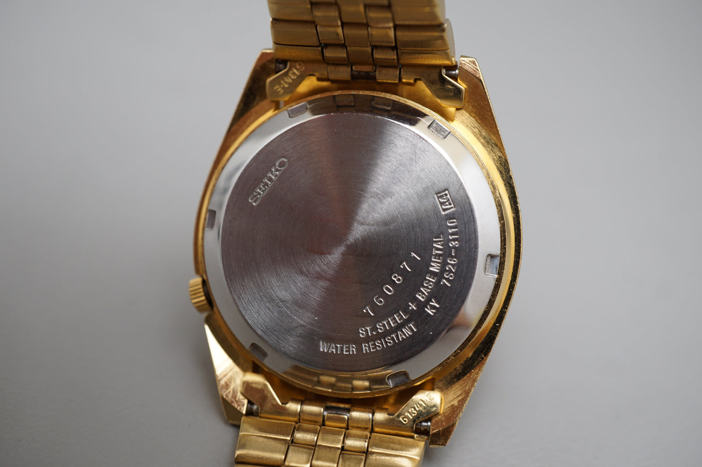 Seiko 5 Sports SNXJ94 7S26 Gold Tone Fluted Bezel Day Date Automatic Watch