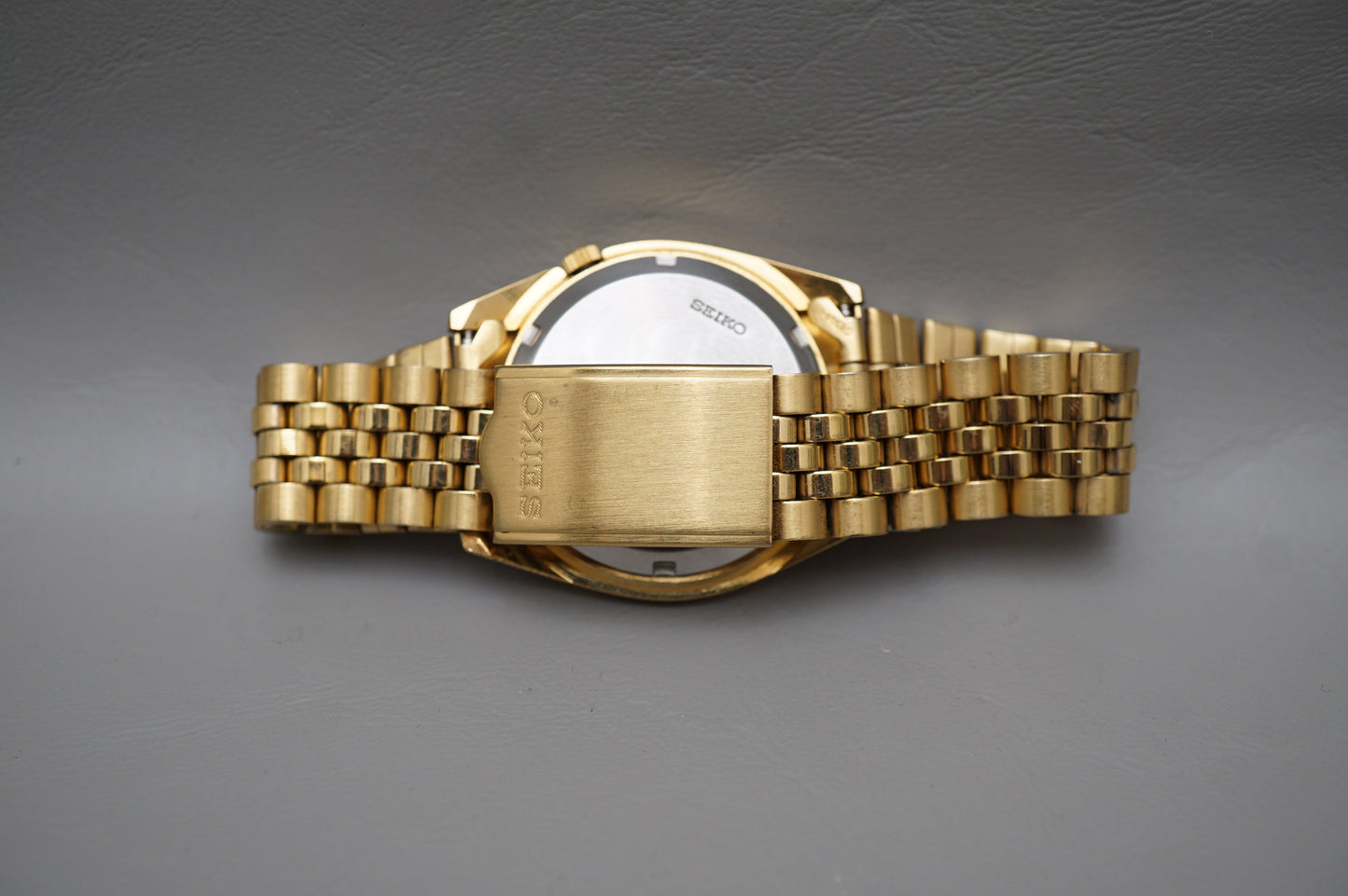 Seiko 5 Sports SNXJ94 7S26 Gold Tone Fluted Bezel Day Date Automatic Watch