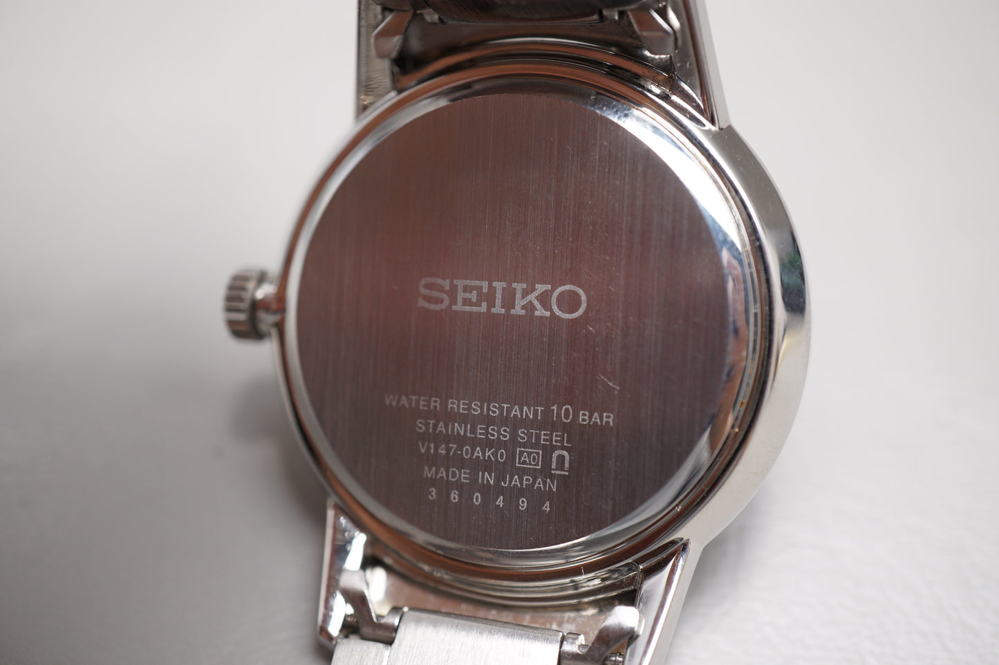 Seiko Spirit V147-0AK0 Black Dial Pink Hands Sector Dial Solar Quartz Watch