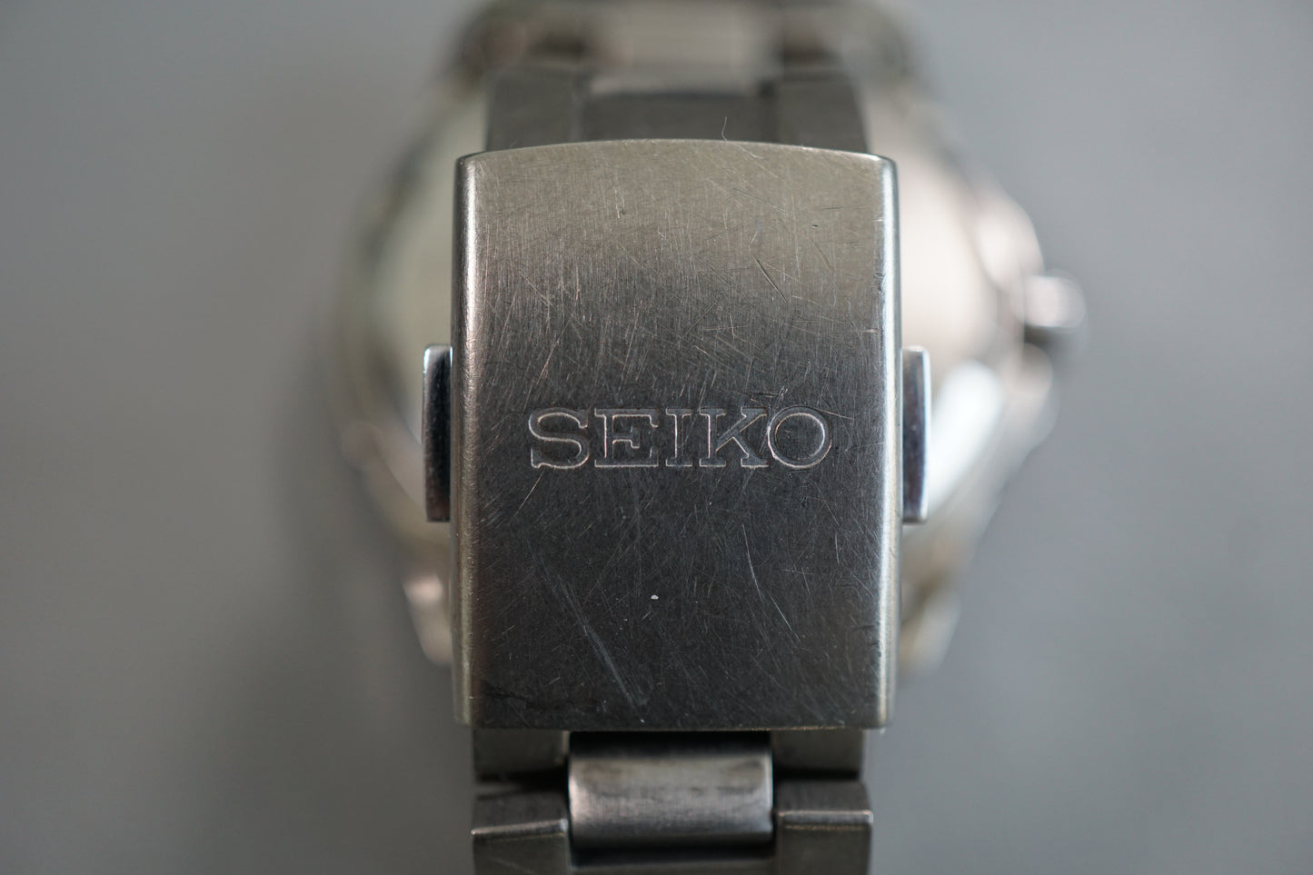 Seiko V14J-0AE0 Titanium Day Date Solar Quartz Watch